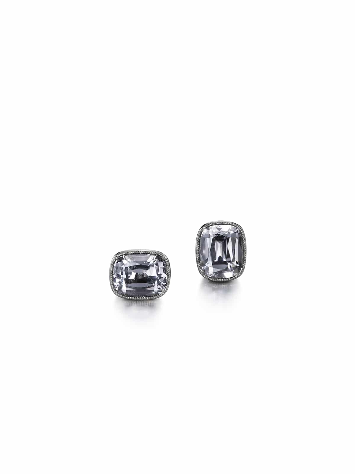 Metallic stud earrings with gray-lilac extraordinary cushion cut spinels set in 18k white gold with milgrain. Design and made by master goldsmith Heidi Vornan