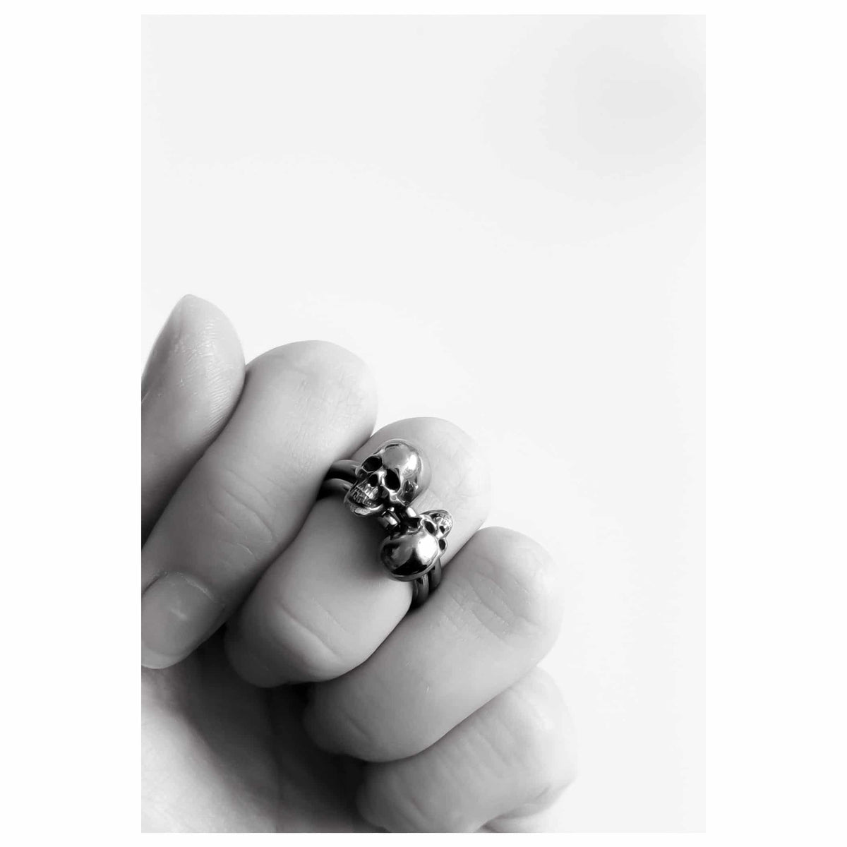 Skull Ring S in blackened sterling silver stacked with skull ring XS.